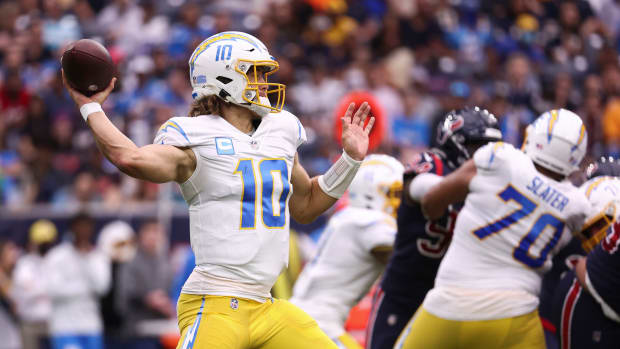 Dec 26, 2021; Houston, Texas, USA; Los Angeles Chargers quarterback Justin Herbert (10) attempts a pass during the second quarter against the Houston Texans at NRG Stadium. Mandatory Credit: Troy Taormina-USA TODAY Sports